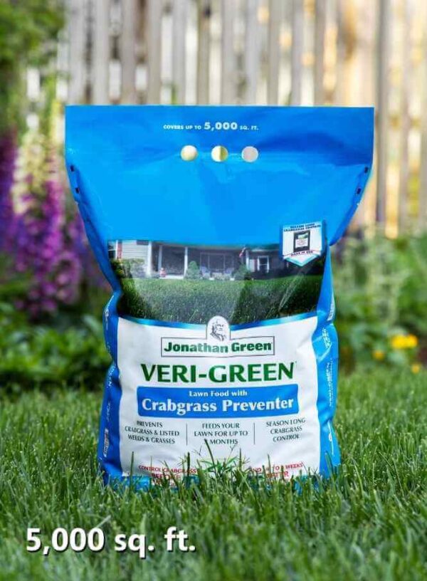A bag of Veri-Green Crabgrass Preventer plus Lawn Fertilizer on a lush grass background.
