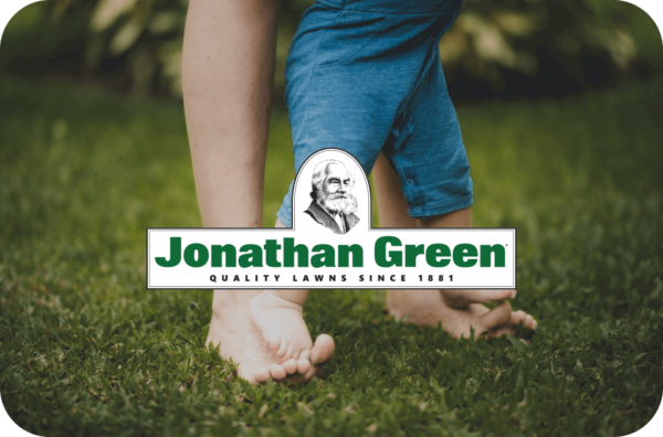 Child standing on a lush lawn with a Jonathan Green eGift Card overlay.