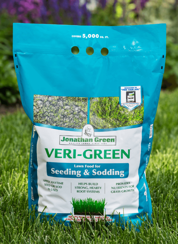 A bag of Jonathan Green Veri-Green Grass Seed & Fertilizer Bundle for Shady Lawns displayed on a grassy background.