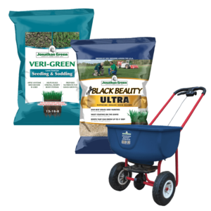Two bags of Lawn Starter Kit, one for seeding and another for grass care, alongside a blue spreader on a white background.
