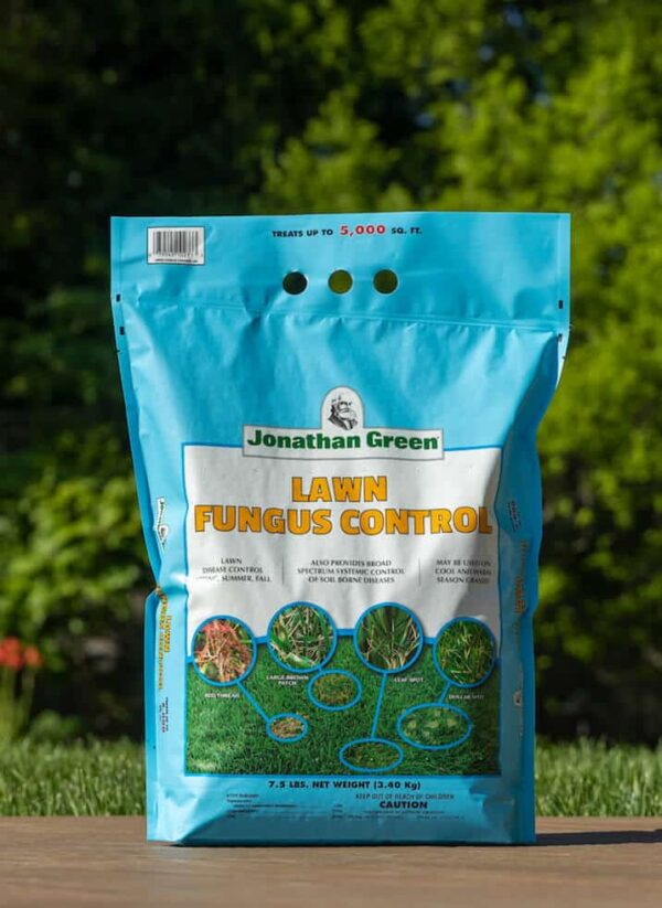 A bag of Jonathan Green lawn fungus control product from the Summer Lawn Care Bundle standing outdoors with a green backdrop.