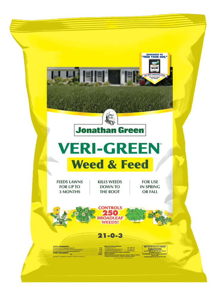 A bag of Jonathan Green Annual Lawn Care Program for Acidic Soil, part of the Jonathan Green Annual Lawn Care Program, with product information and a residential backdrop.